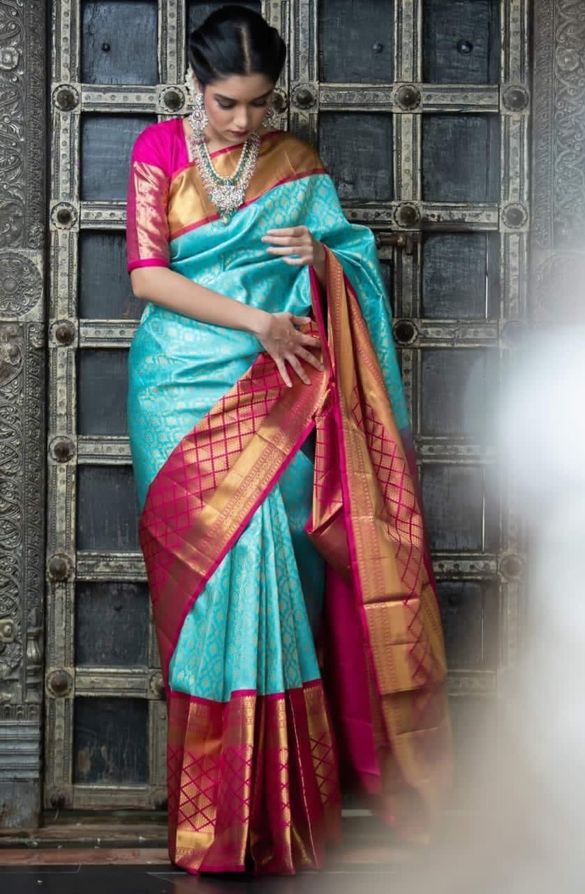 Elegant Turquoise Silk Saree with Contrast Pink Border