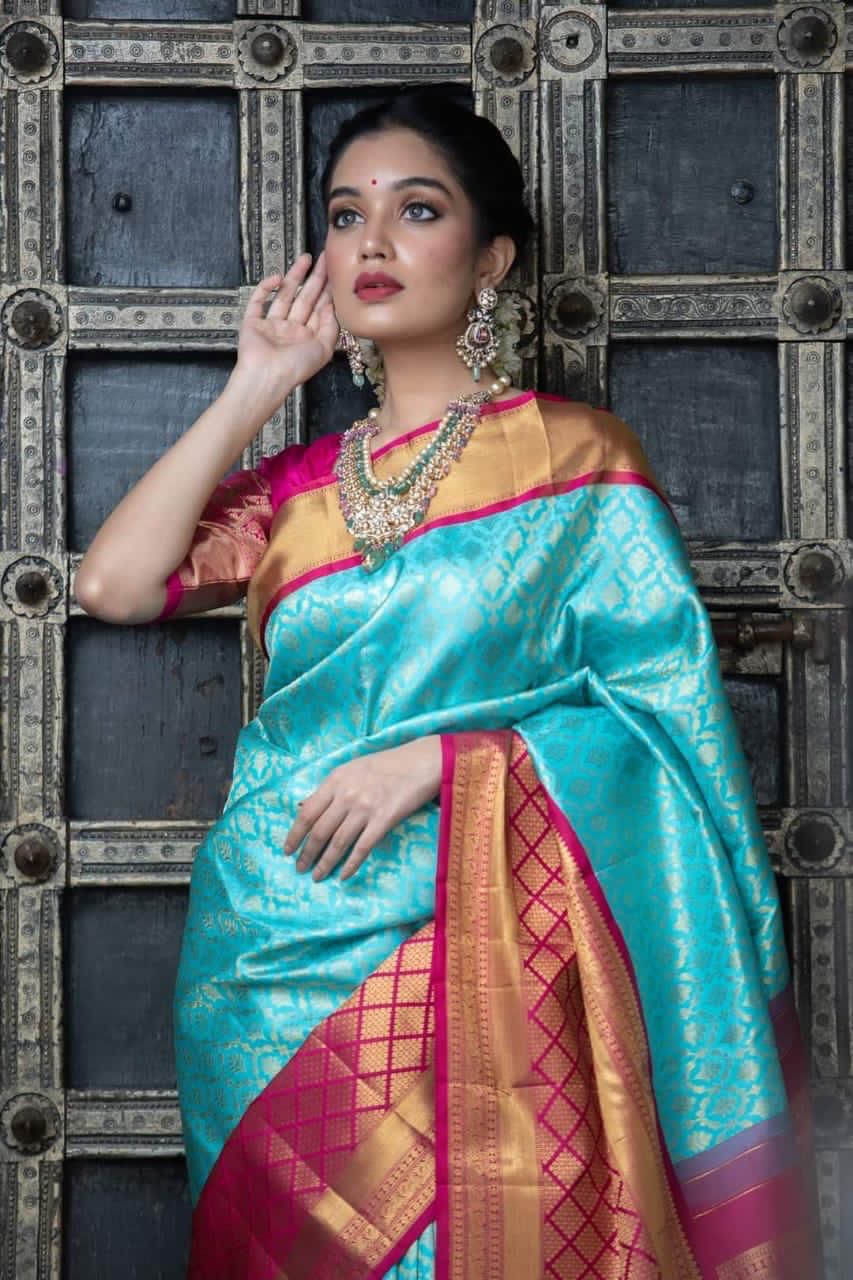 Elegant Turquoise Silk Saree with Contrast Pink Border
