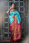 Elegant Turquoise Silk Saree with Contrast Pink Border